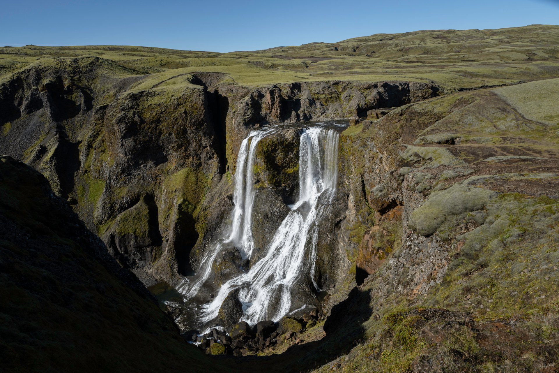 Fagrifoss dropping into its amphitheater canyon with columnar basalt
