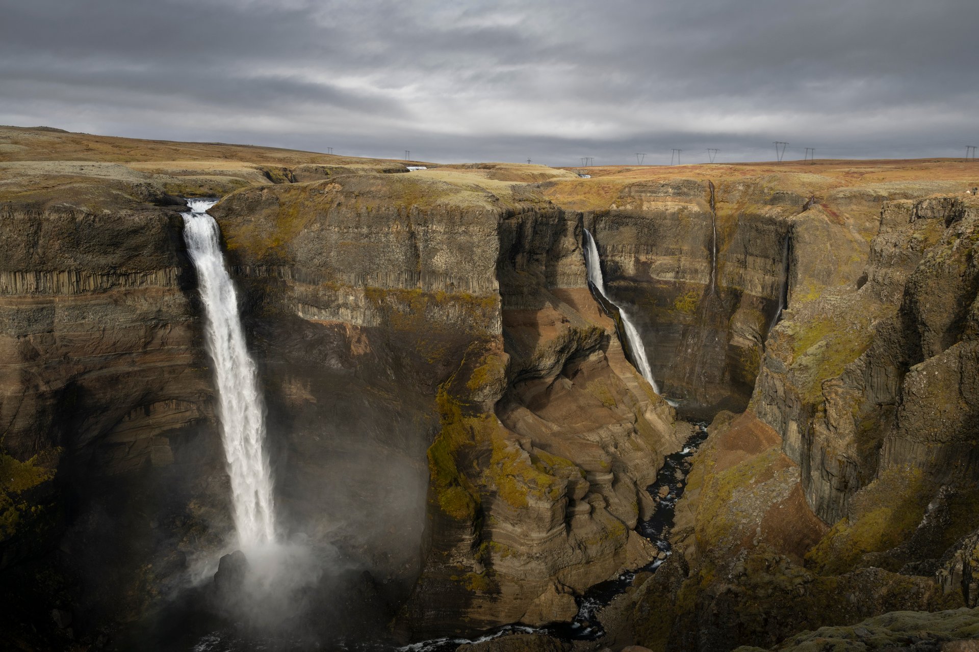 Háifoss dropping 122 meters into the canyon with Granni beside it