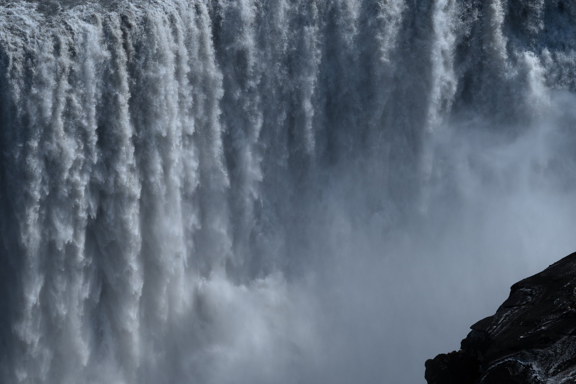 Stunning Icelandic waterfall surrounded by dramatic volcanic landscape