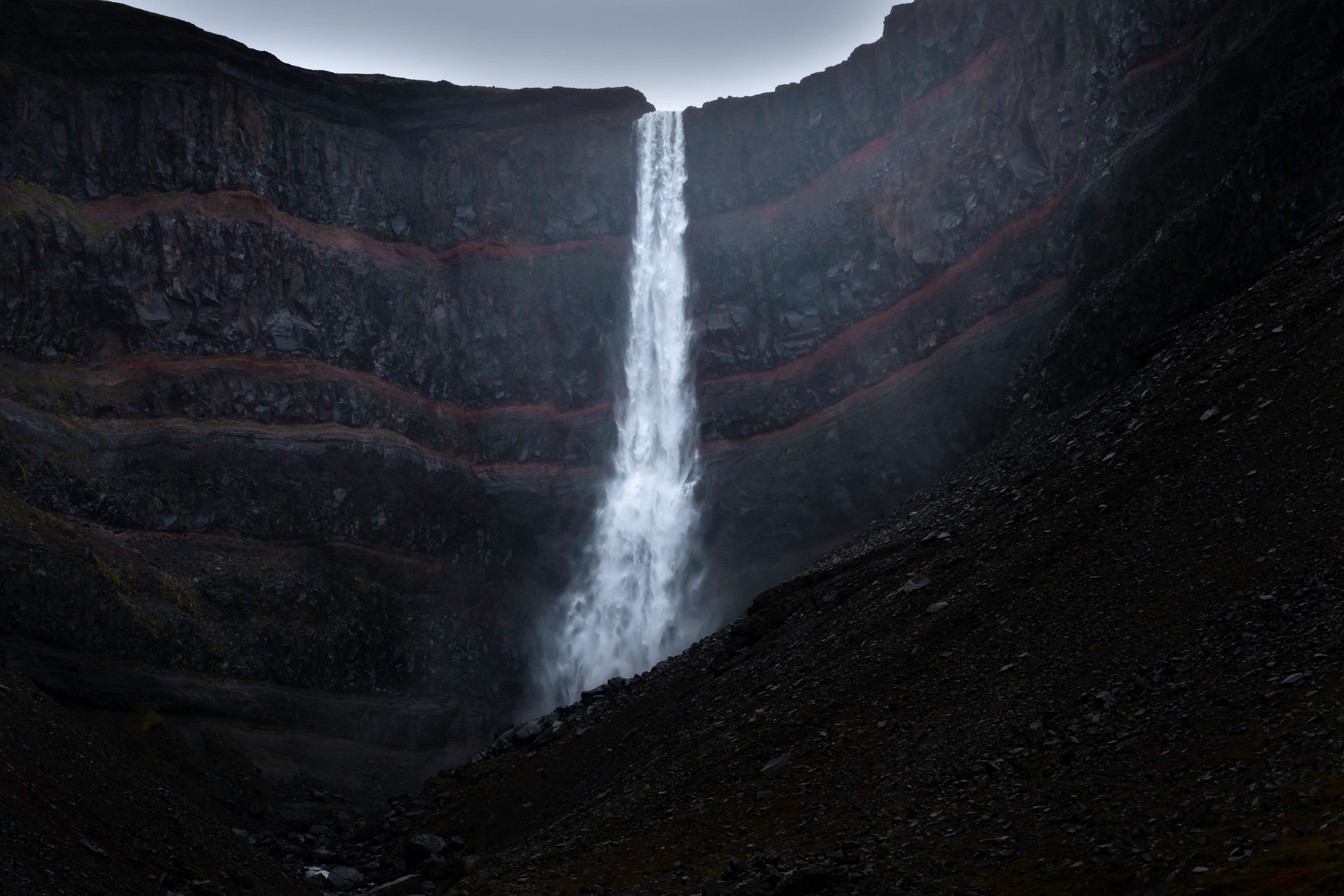 Geological layers behind Hengifoss in East Iceland