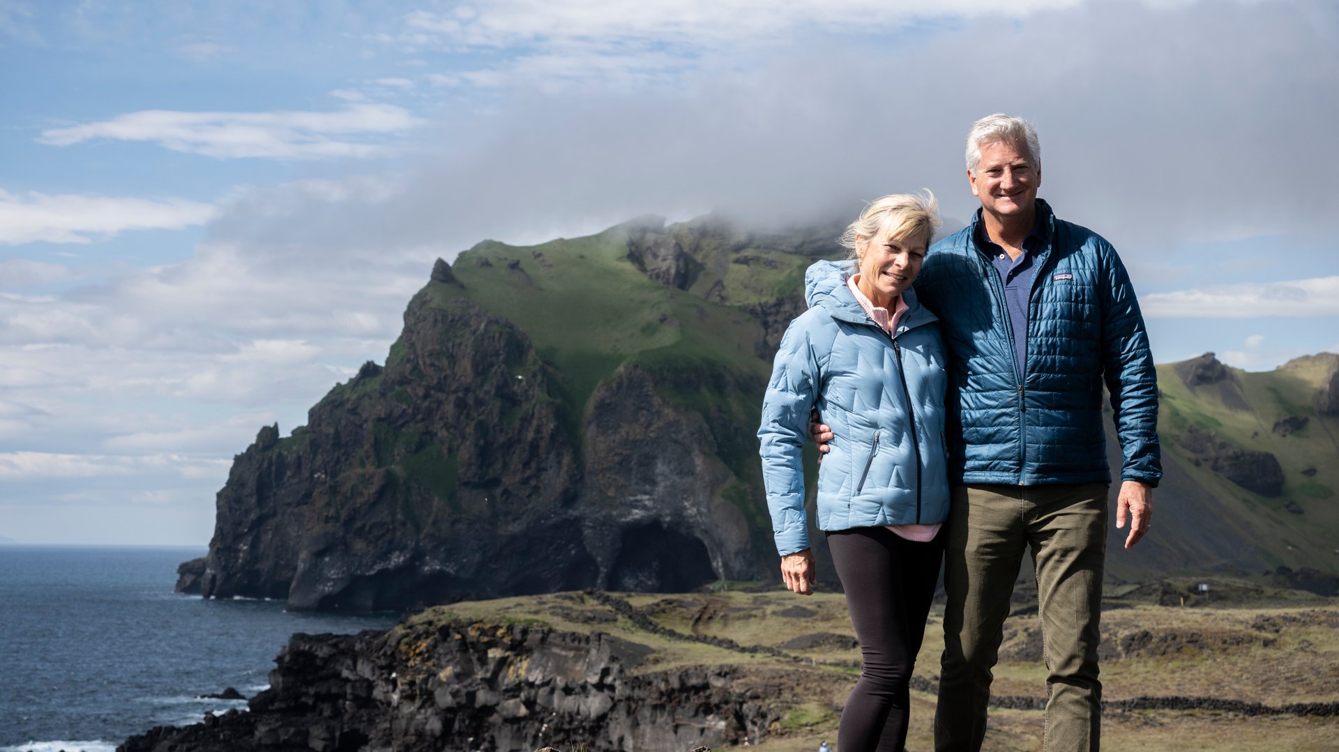 Travelers enjoying the view at Elephant Rock, Westman Islands