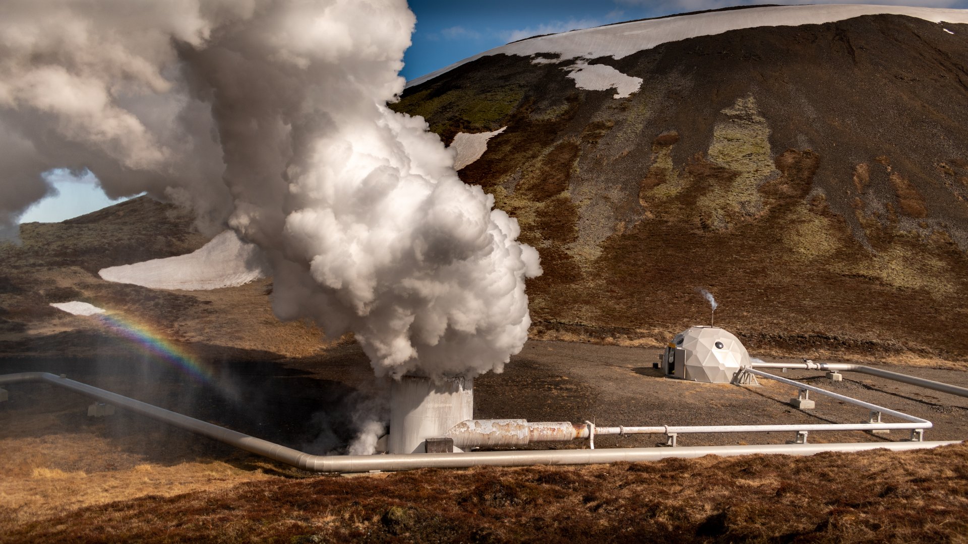 Boiling mud pots and colorful mineral deposits along the Hengill Educational Trail
