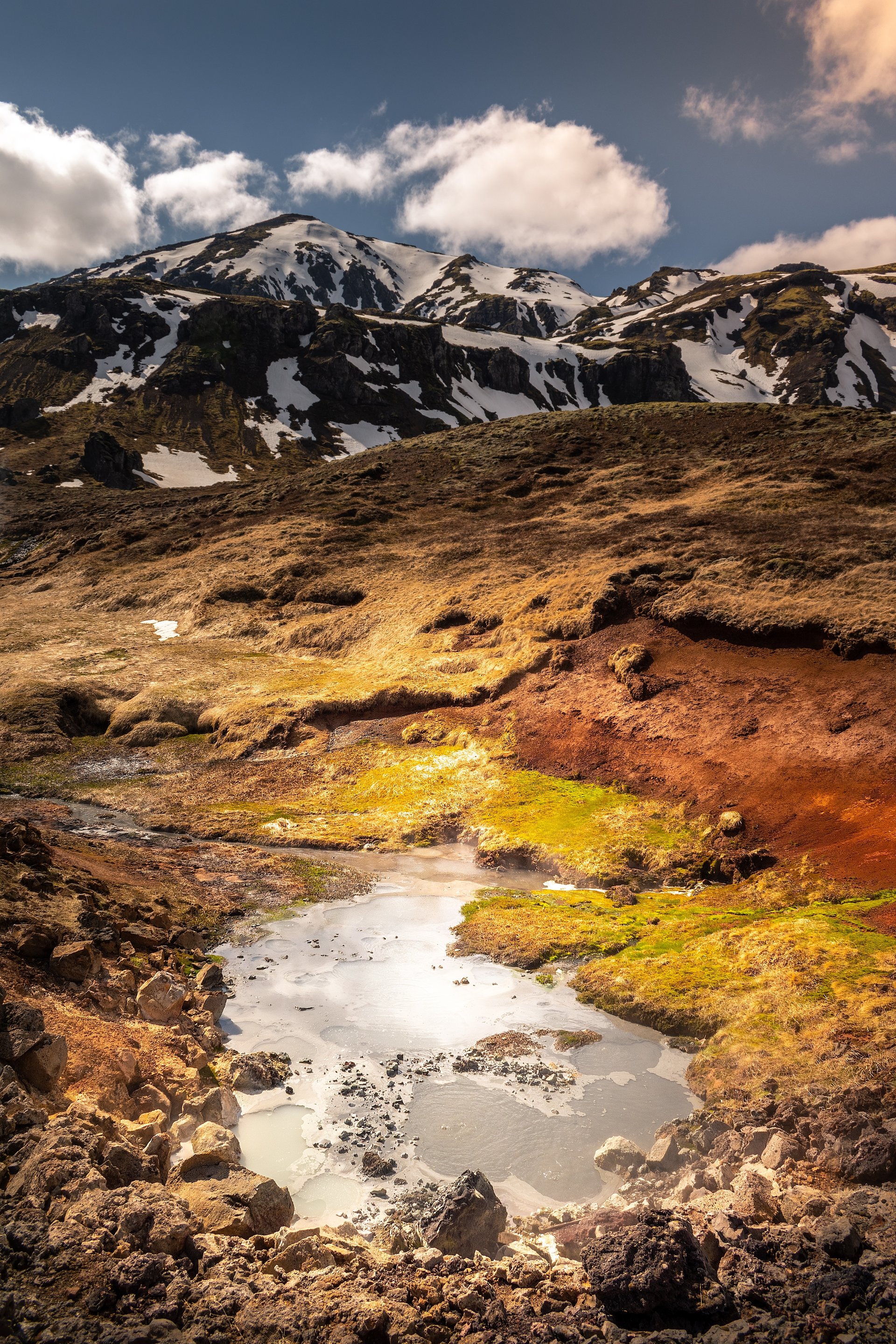 Moss-covered lava and geothermal steam along the Hengill trail near Þingvallavatn