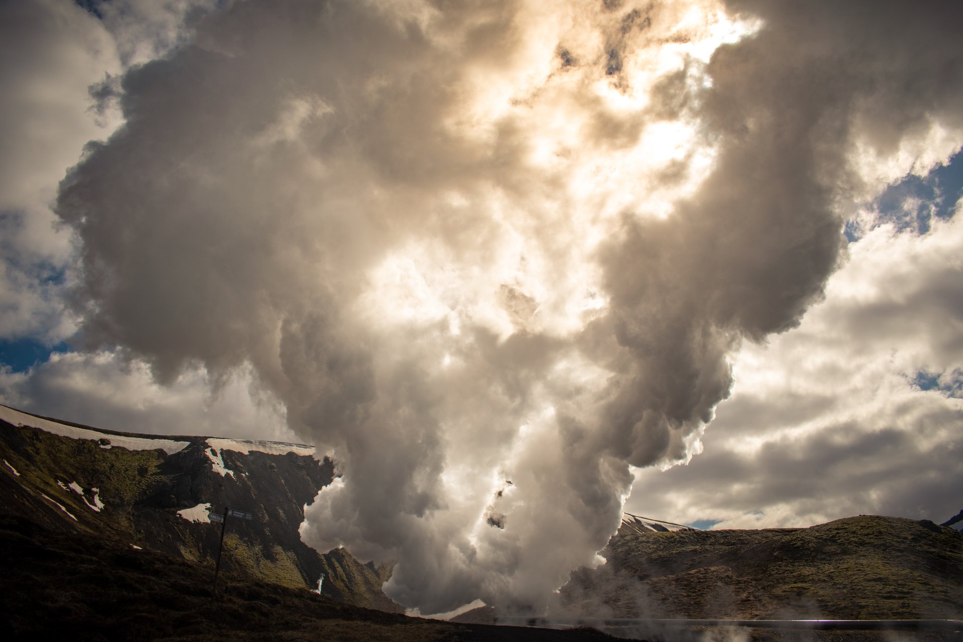 Hikers walking through the geothermal landscape of the Hengill area near Nesjavellir
