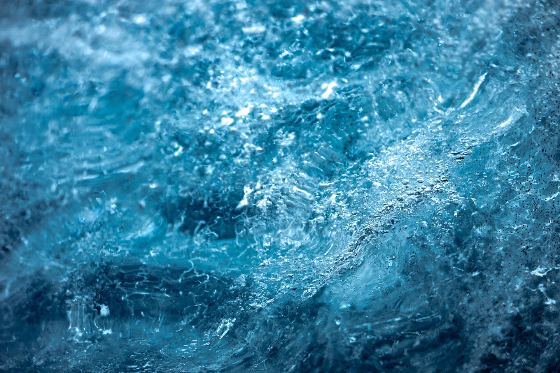 Vivid blue ice formations inside a Vatnajökull glacier cave