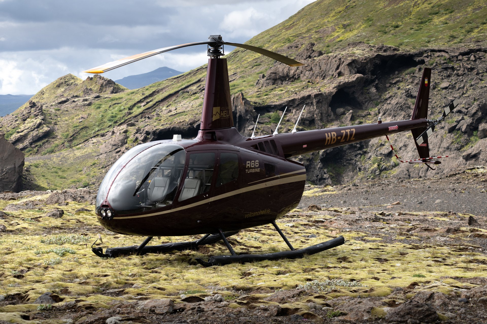 Helicopter flying over Iceland's glaciers and volcanic landscapes aerial view