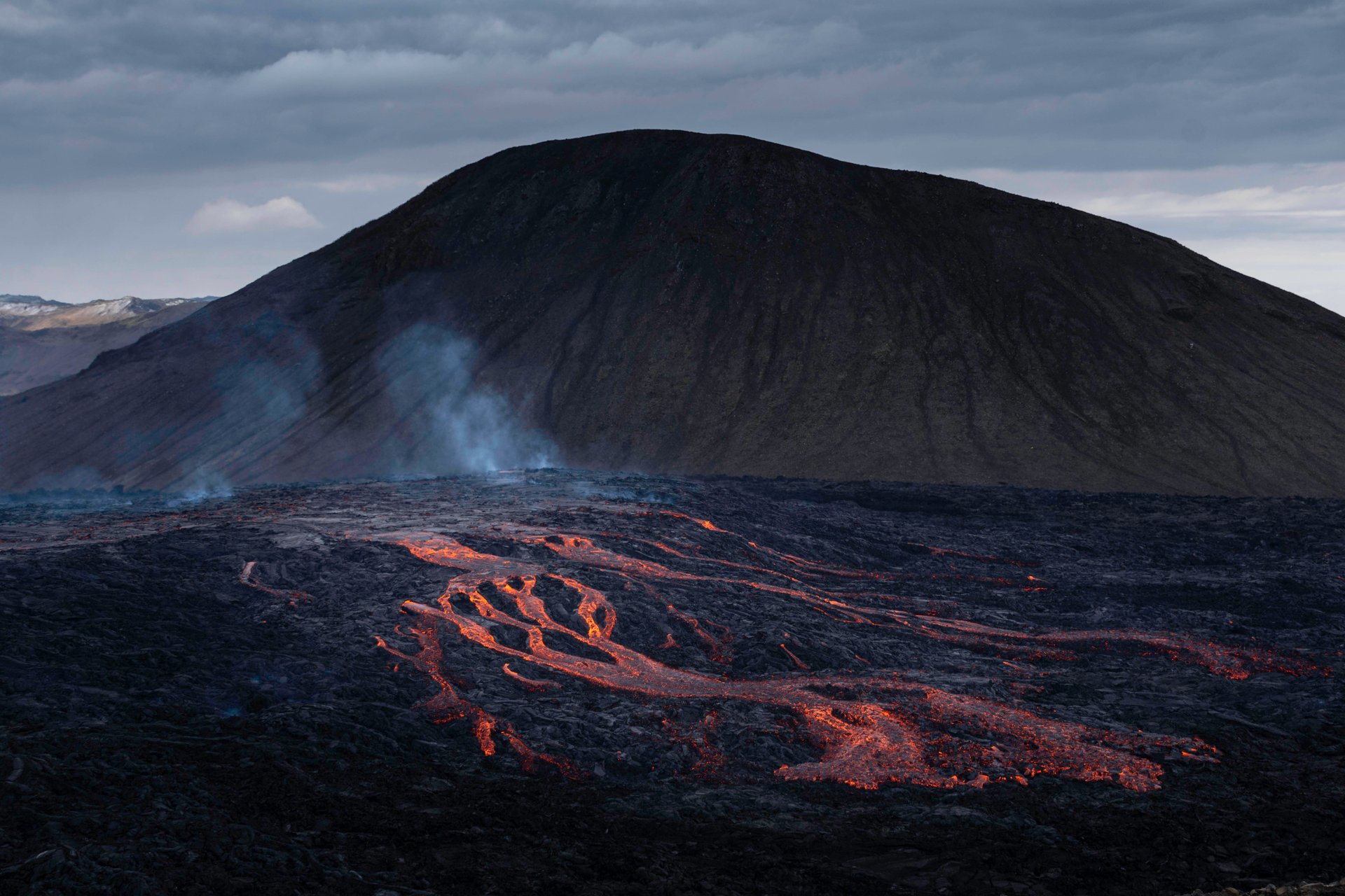 Night view of Fagradalsfjall eruption glowing orange lava