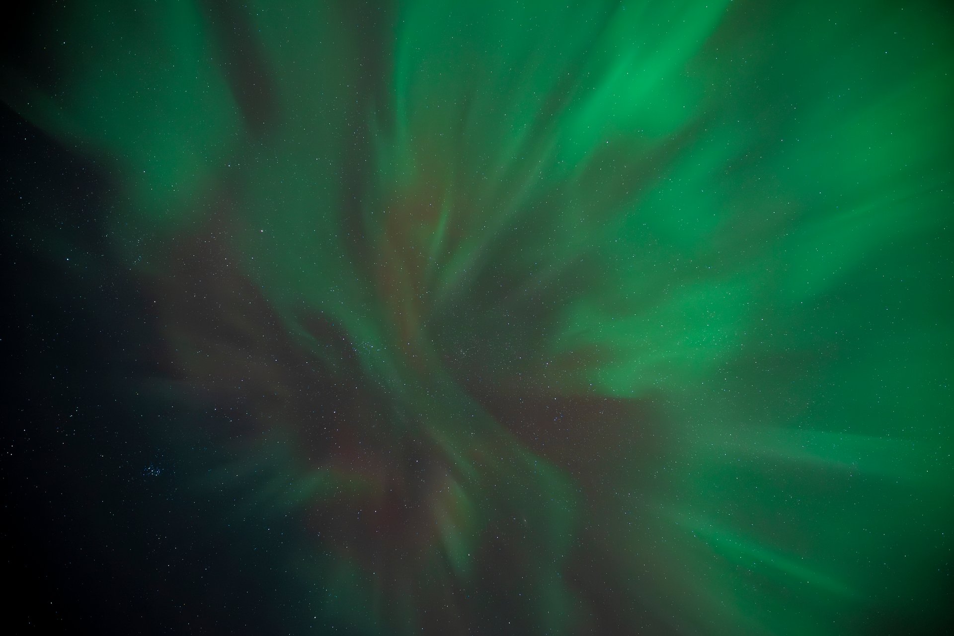 Northern Lights beginning to appear in Iceland's evening sky