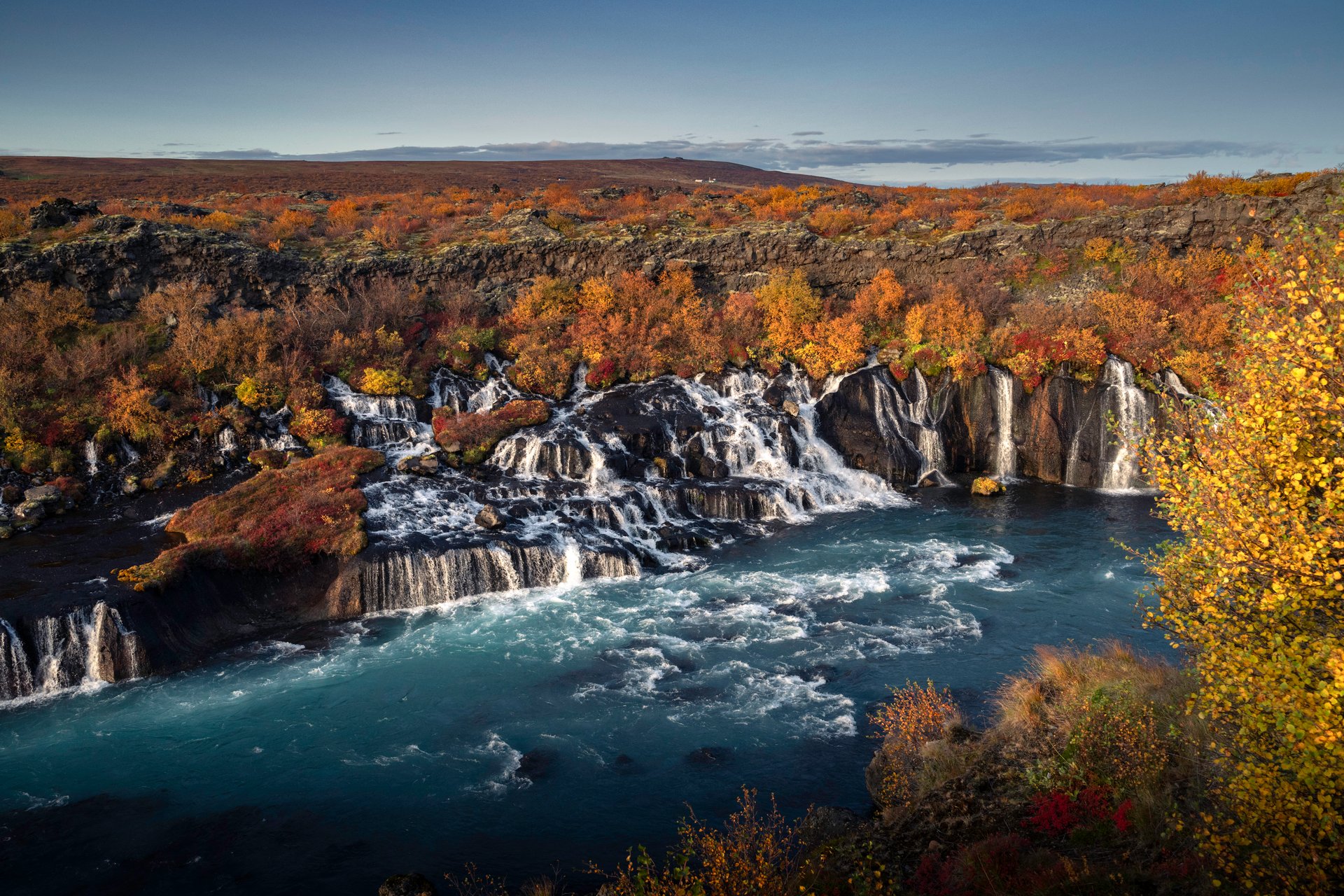 Hraunfossar lava waterfalls cascading into the turquoise Hvítá river