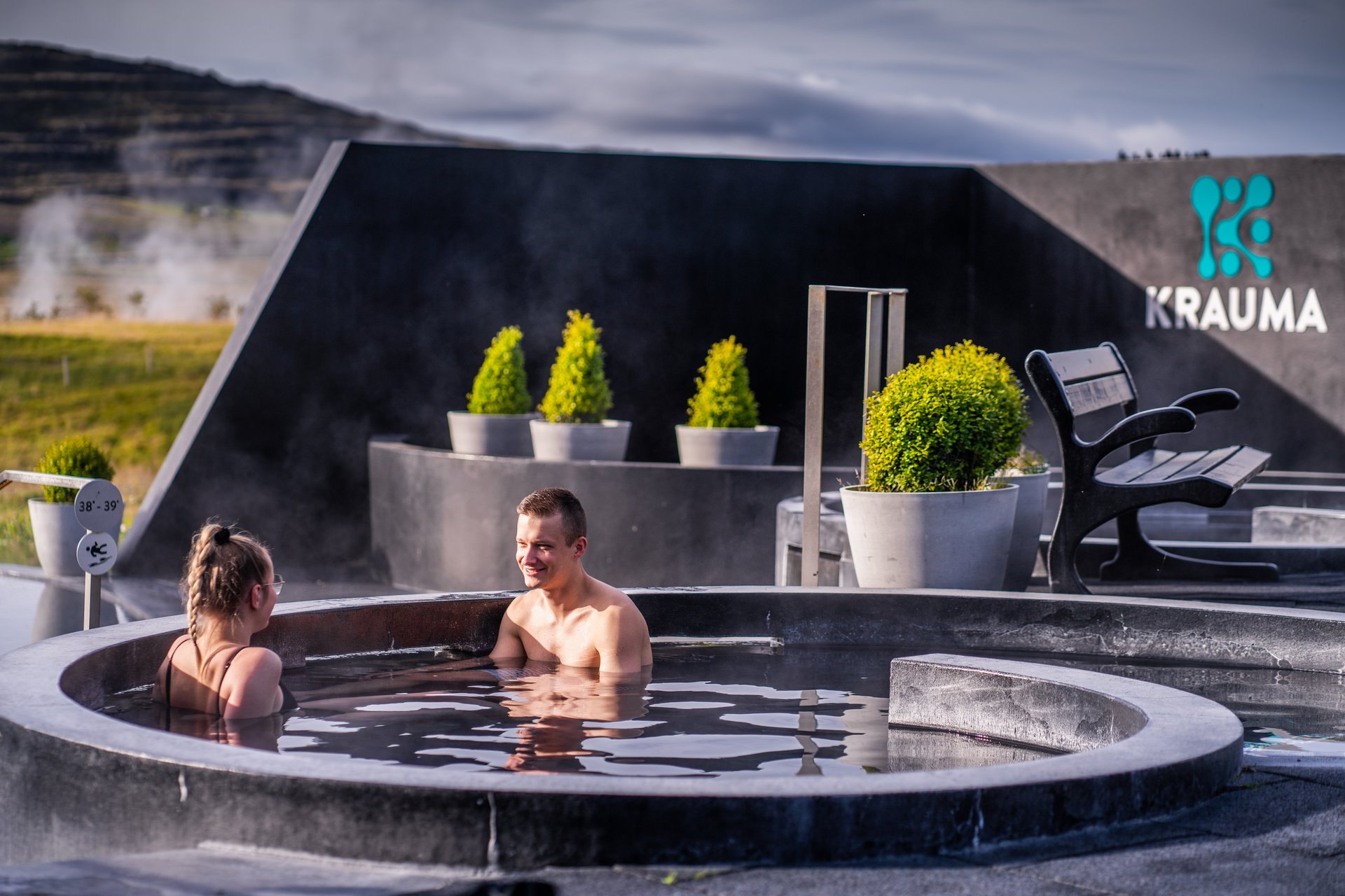 Krauma geothermal spa with steam rising from the hot pools