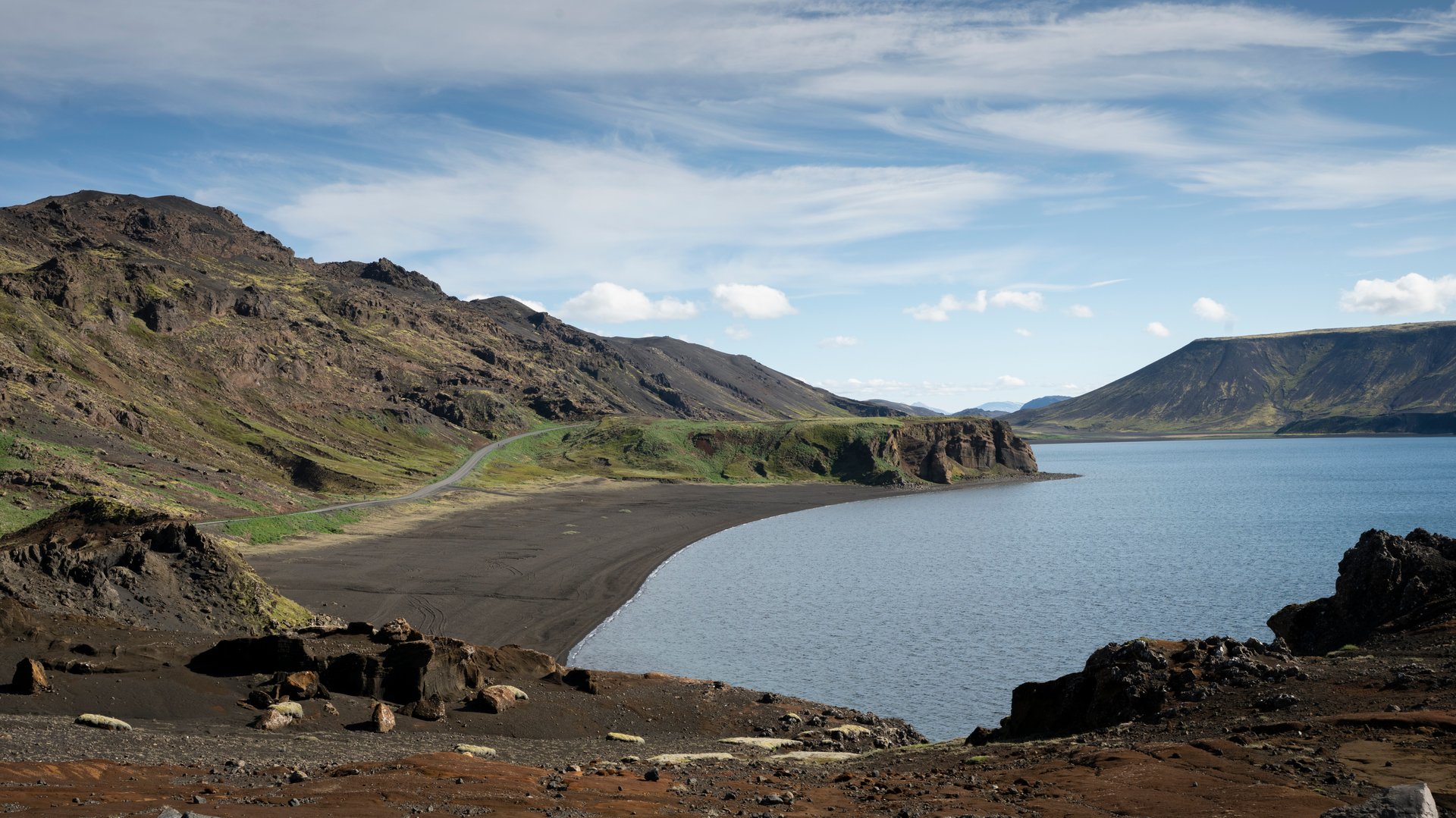 Kleifarvatn lake in a rift between lava fields on a still June morning Reykjanes Iceland