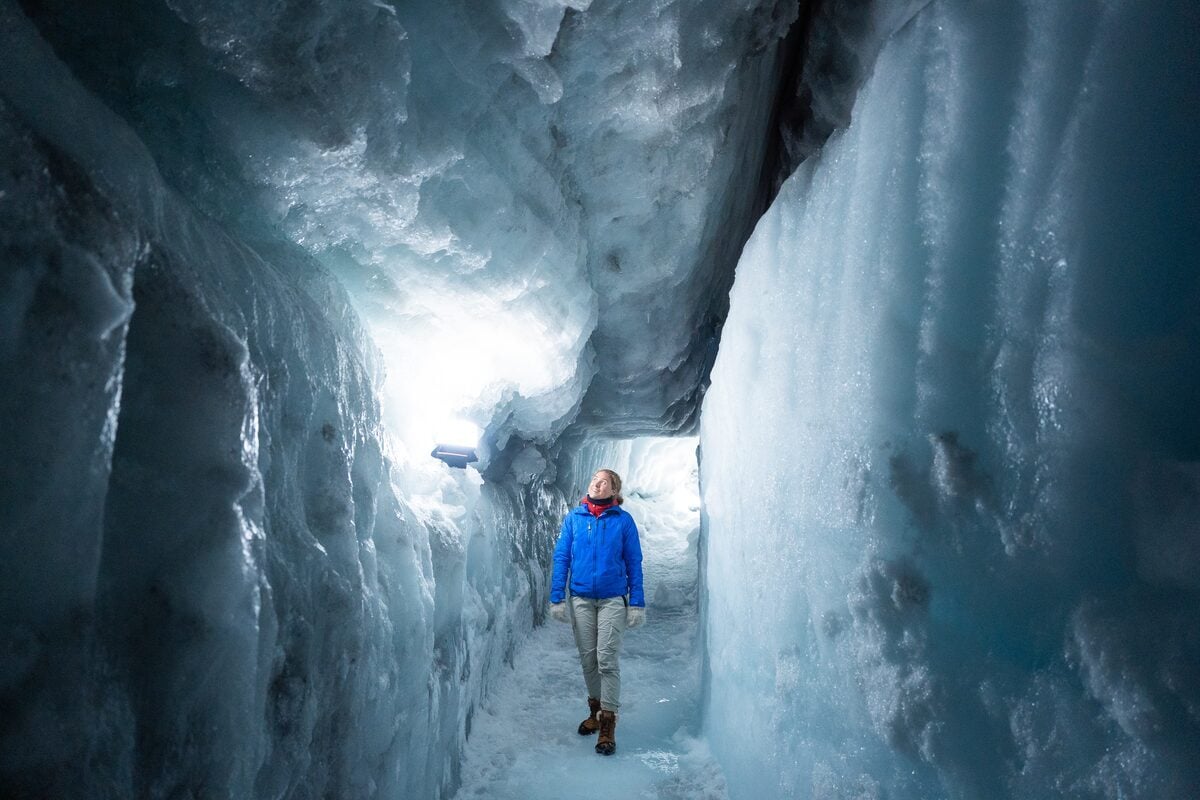 Into the Glacier ice tunnel inside Langjökull with blue ice walls