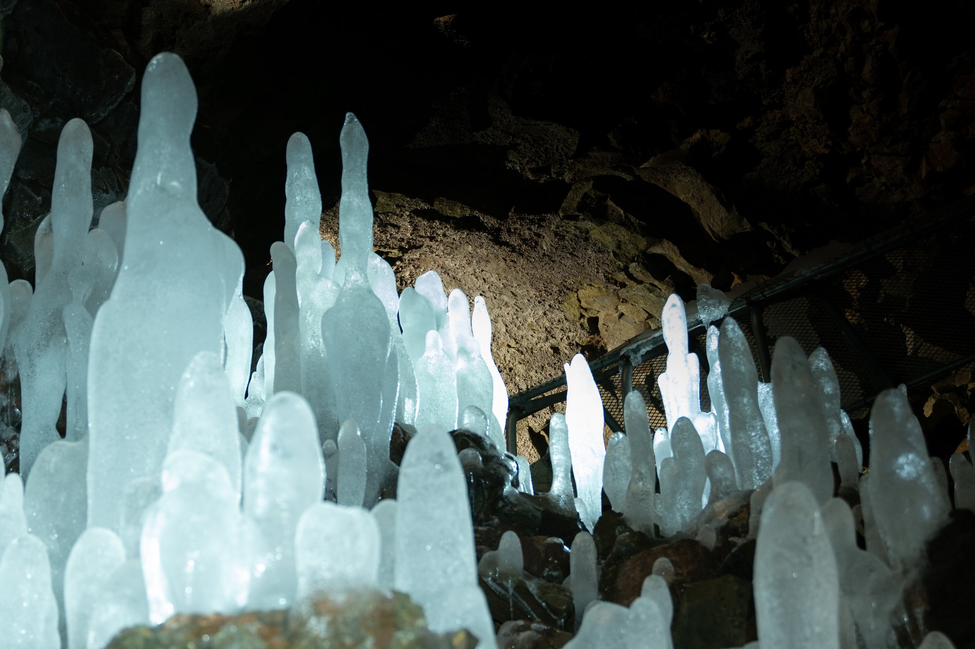 Víðgelmir lava cave entrance with visitors exploring the tunnel