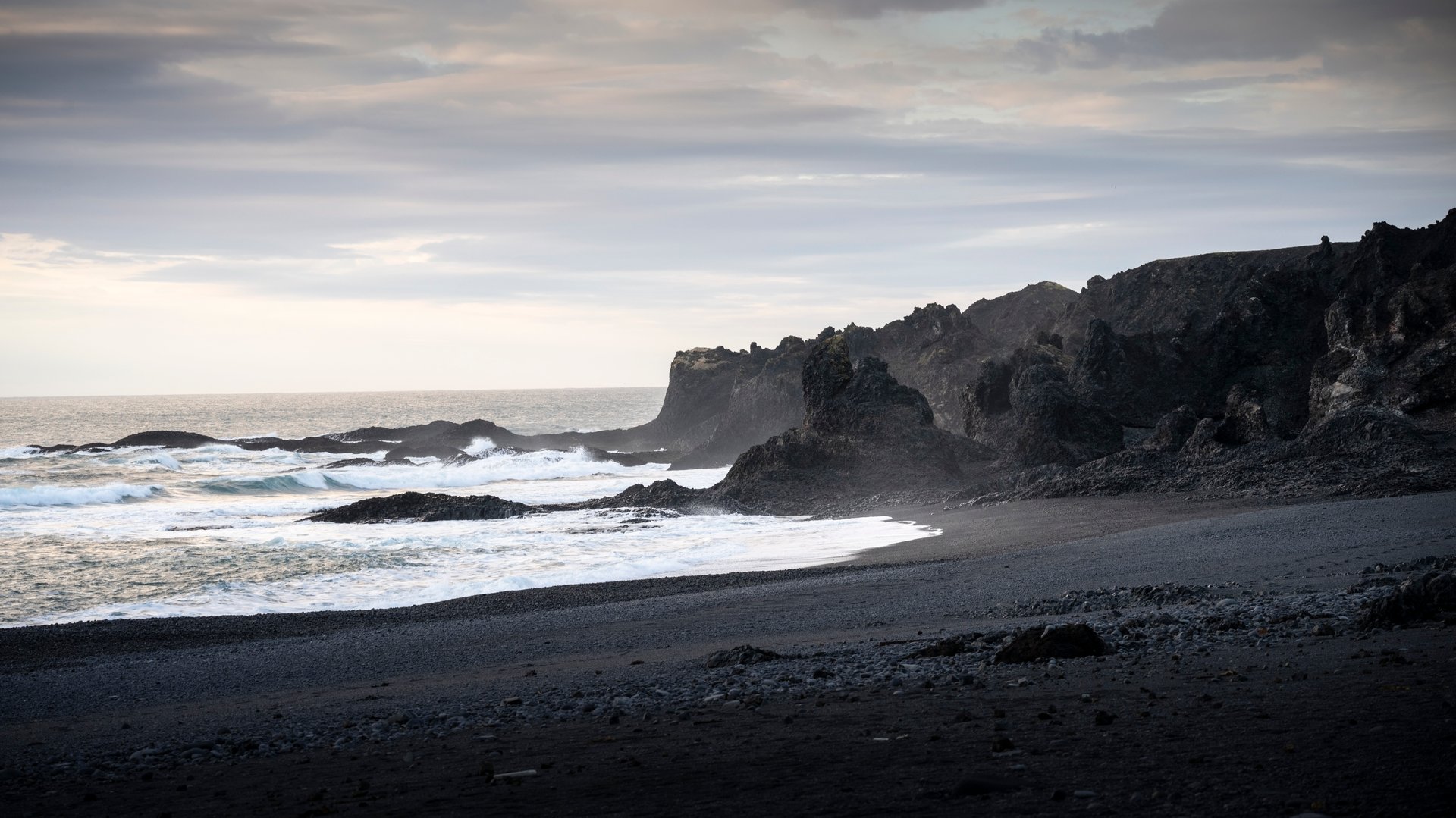 Djúpalónssandur black sand beach with lava formations Iceland