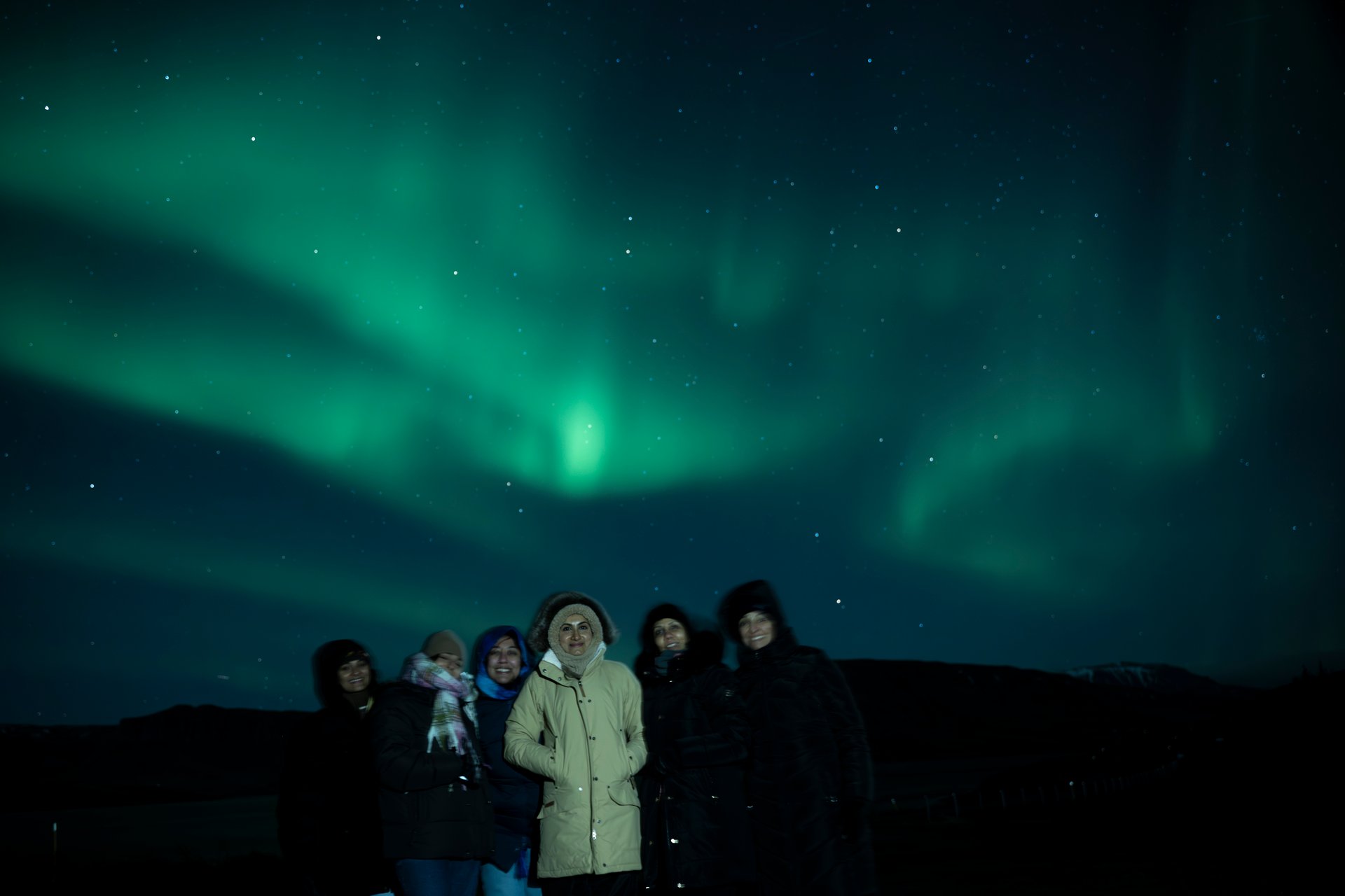 Clients watching the Northern Lights on a private tour