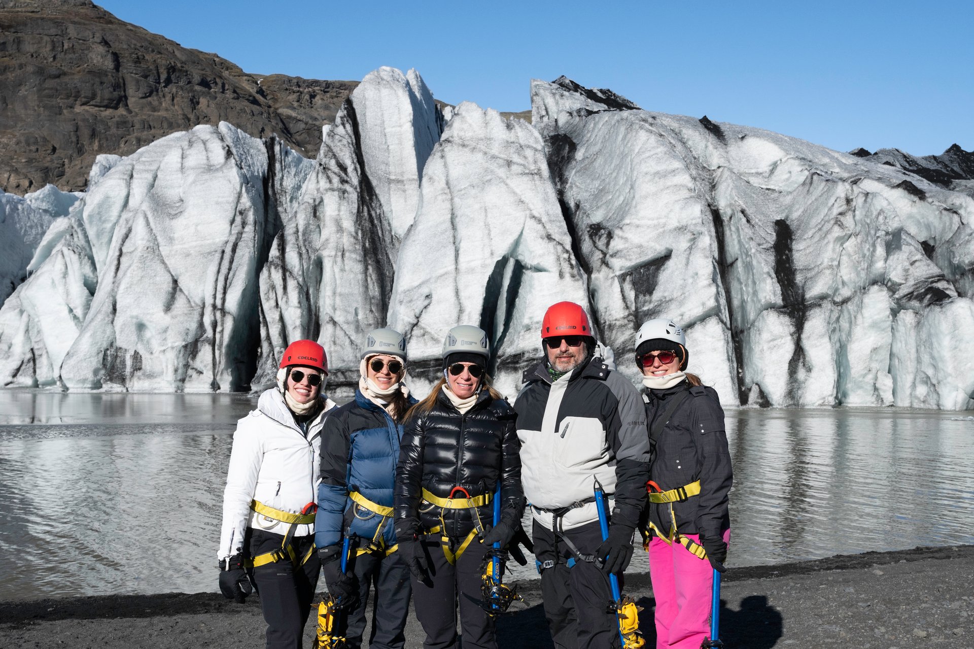 Clients glacier hiking in winter with full proper equipment