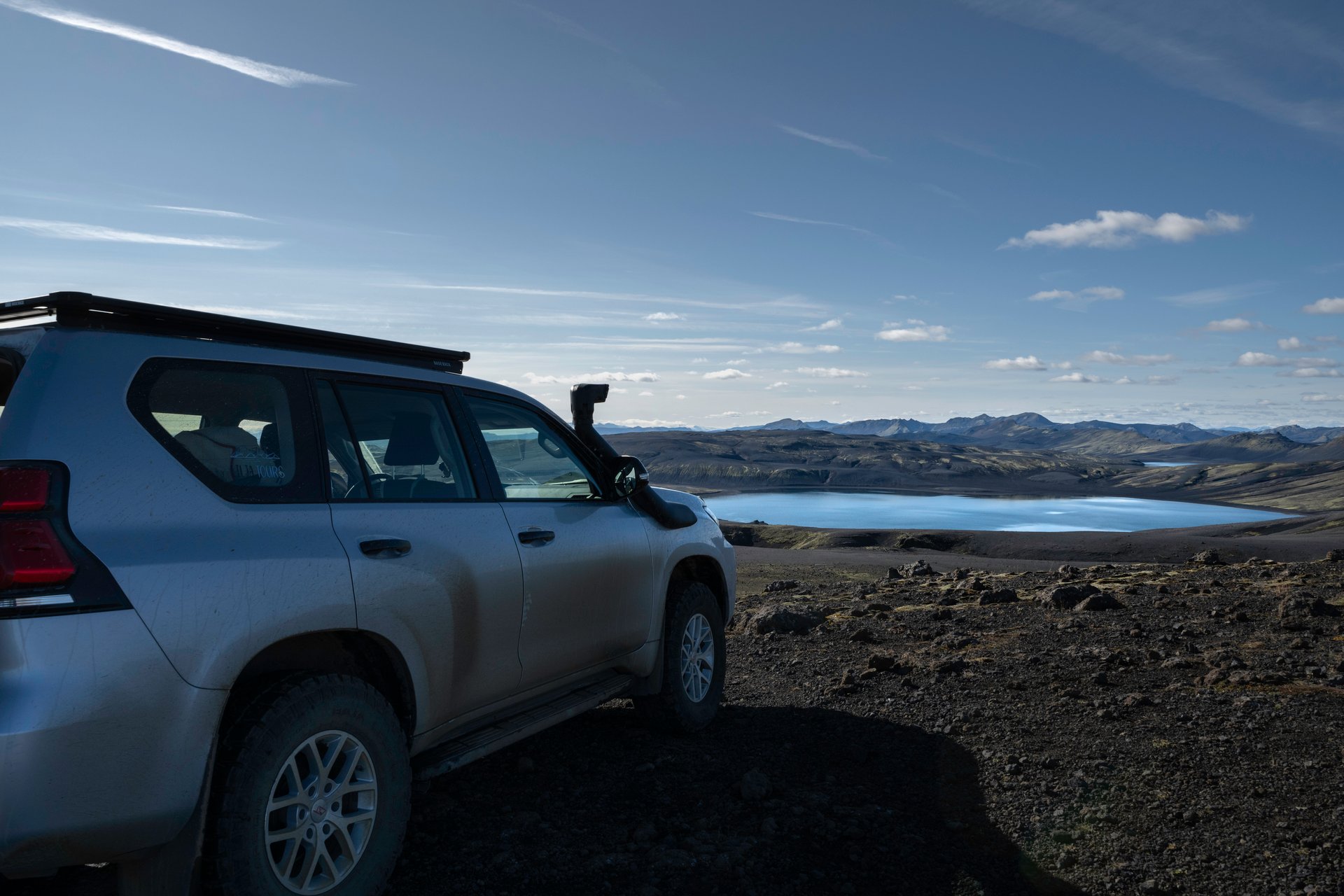 Toyota Land Cruiser driving through the Icelandic Highlands landscape