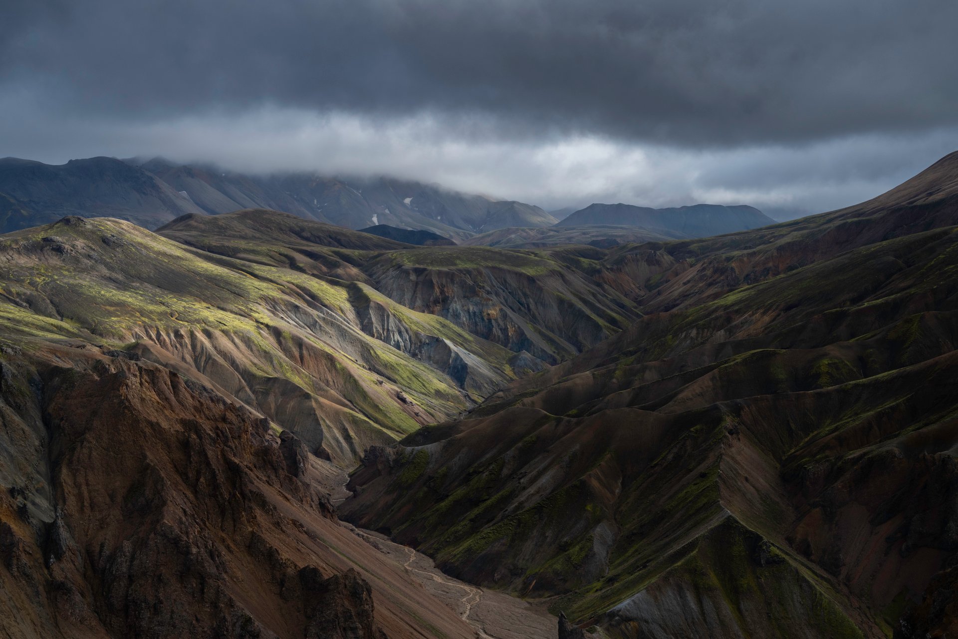 Hikers exploring the colorful landscape of Landmannalaugar