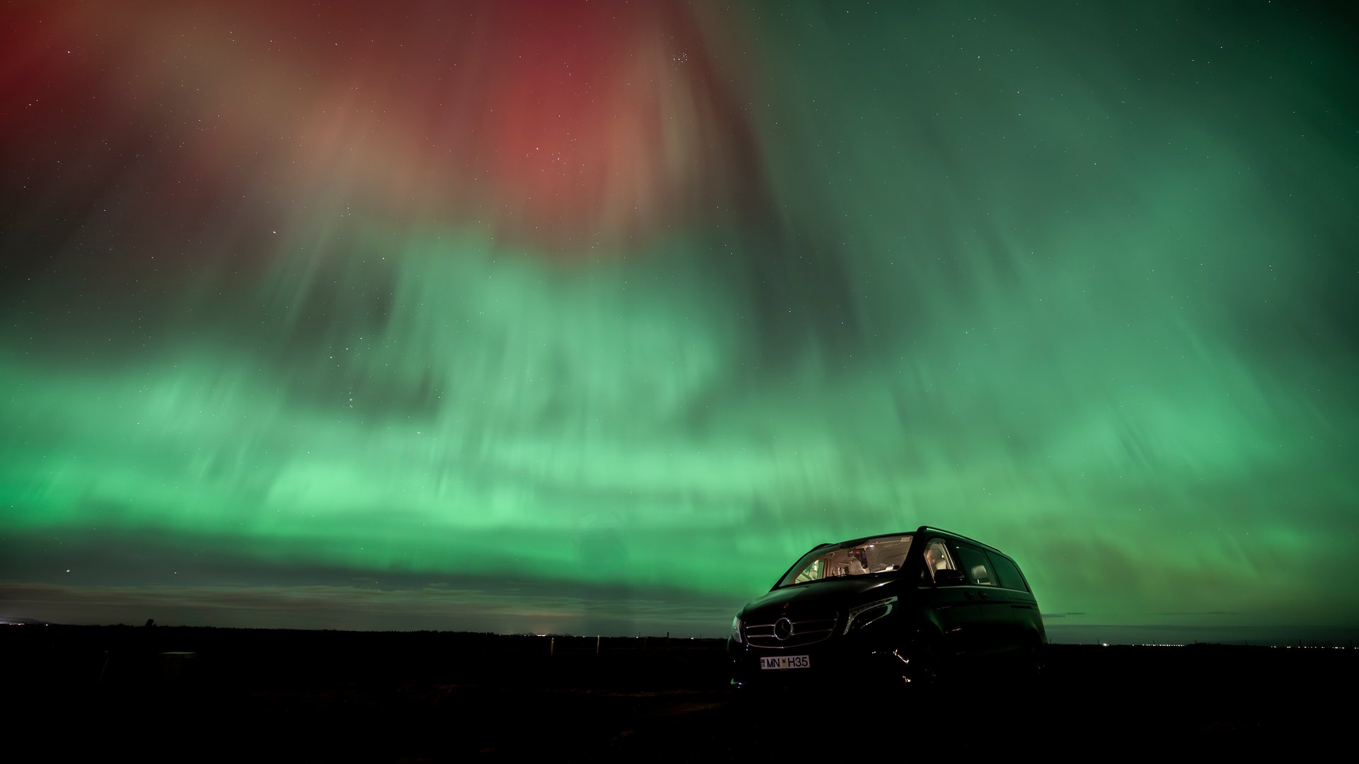Northern Lights Aurora Borealis over Iceland's dramatic landscape