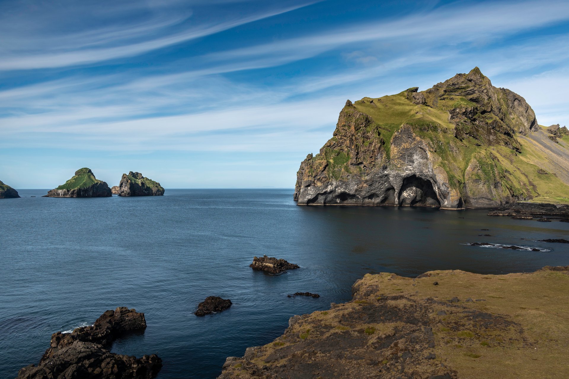 Westman Islands with dramatic volcanic cliffs and puffin colonies