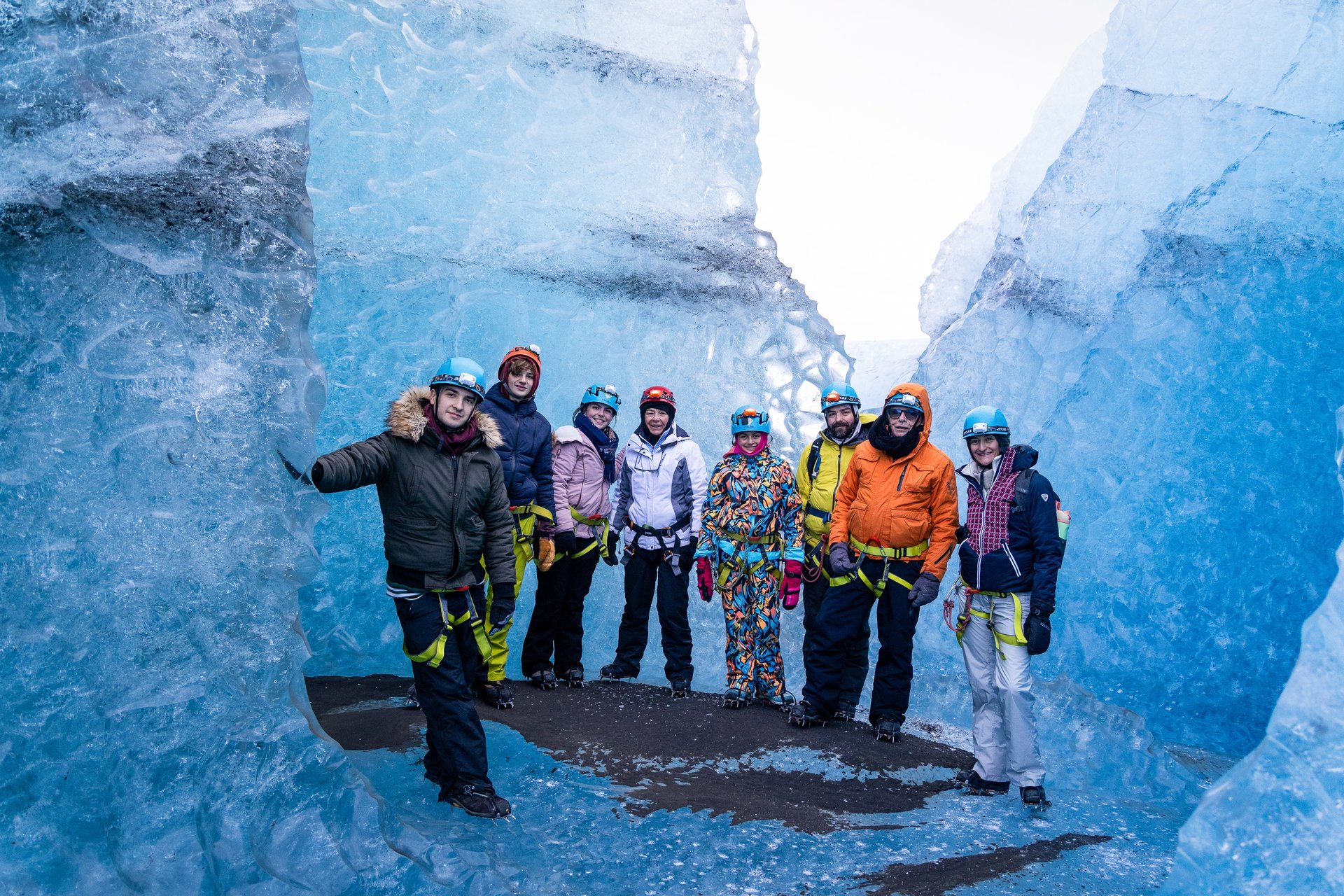 Exploring blue ice cave chambers at Jökulsárlón with guide