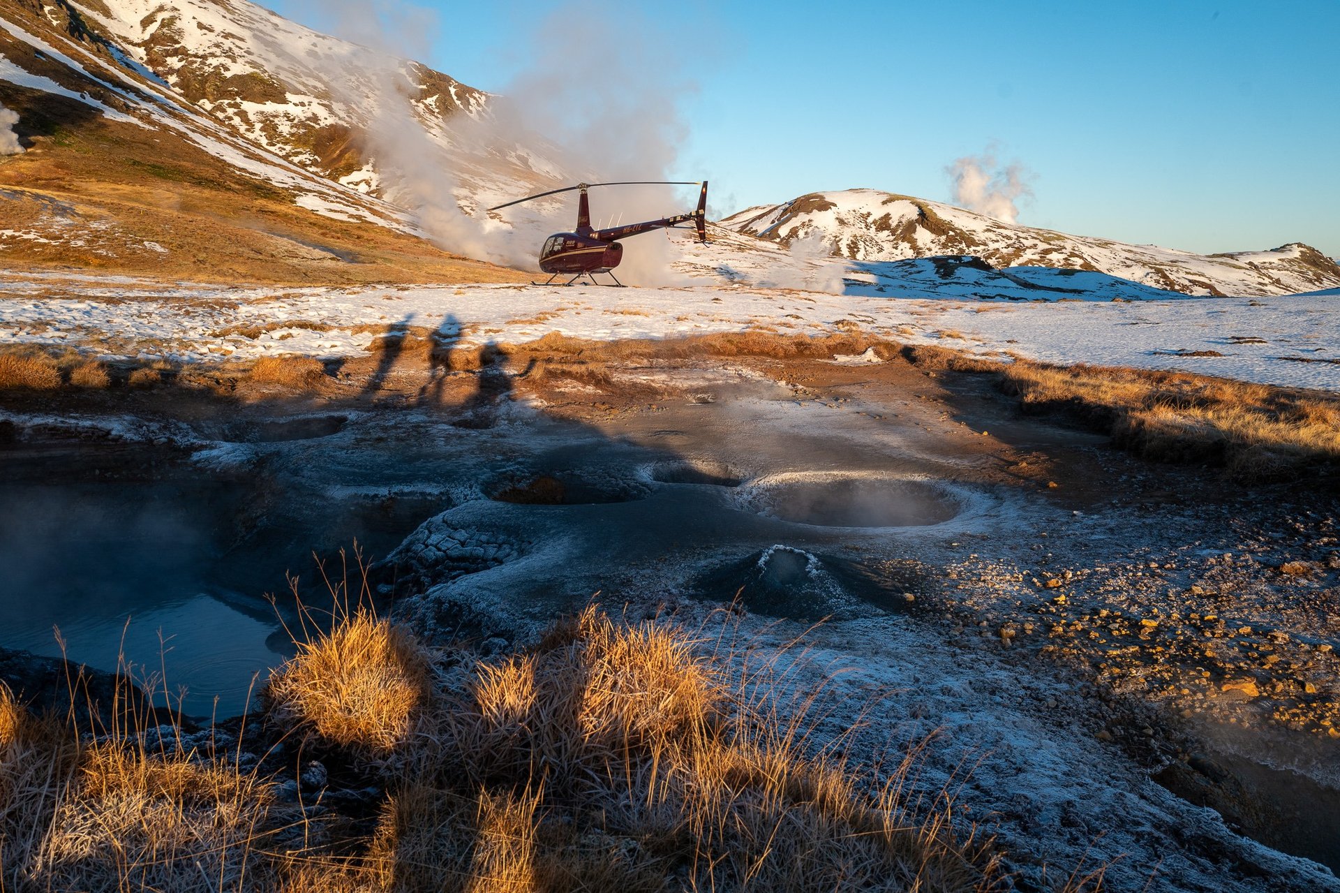 Helicopter landing in remote Icelandic wilderness valley