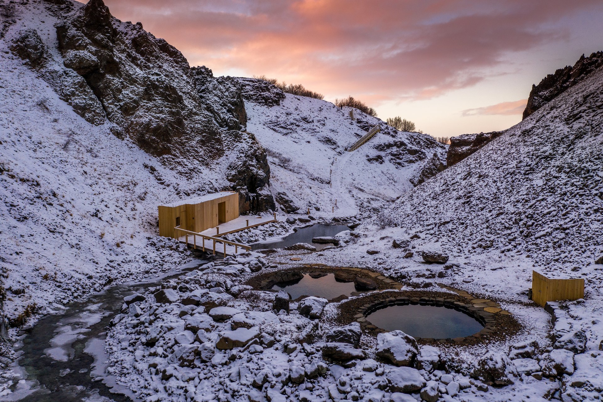 Visitors relaxing in mineral-rich waters surrounded by pristine nature