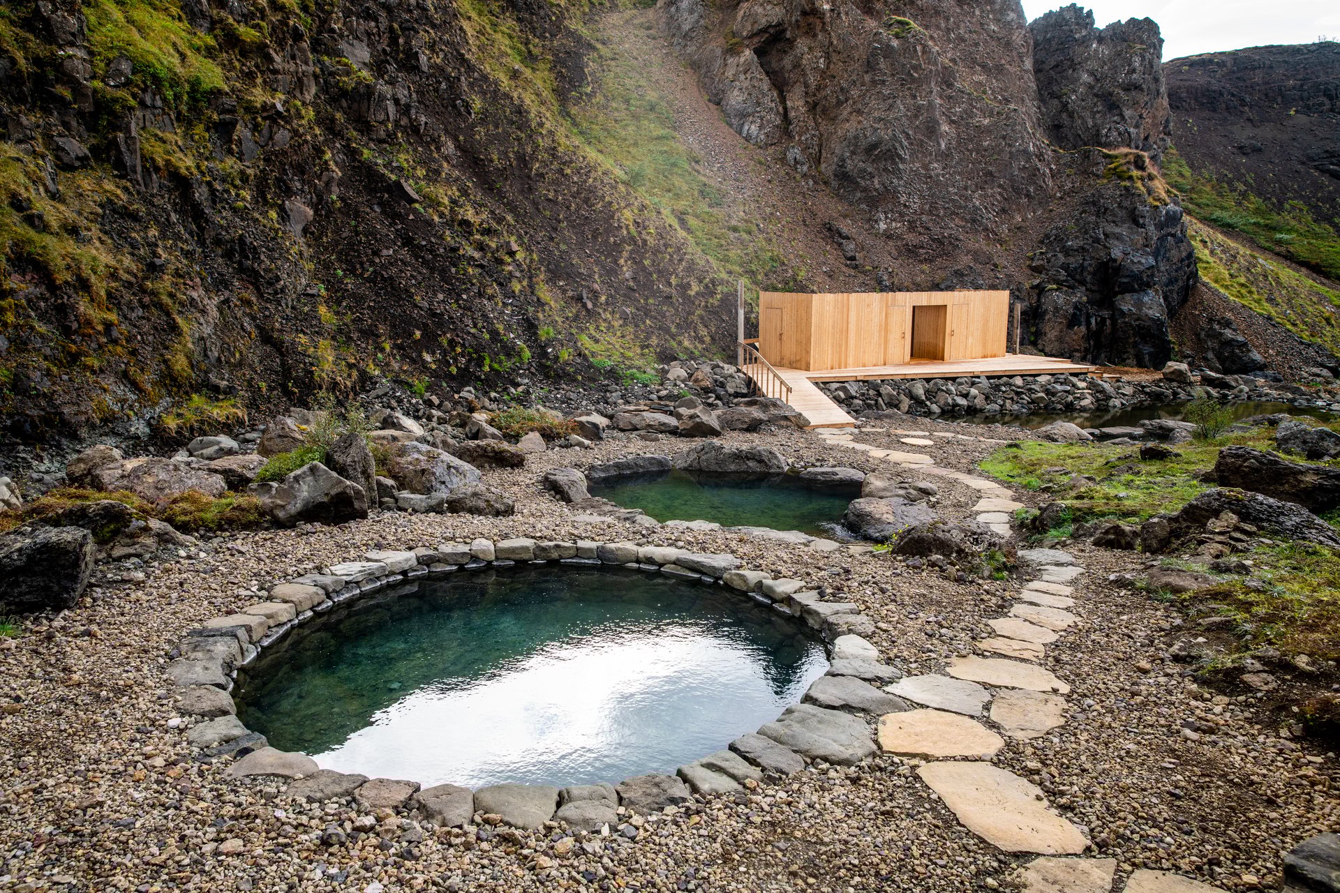 Exclusive highland hike to geothermal canyon baths with Langifoss waterfall views