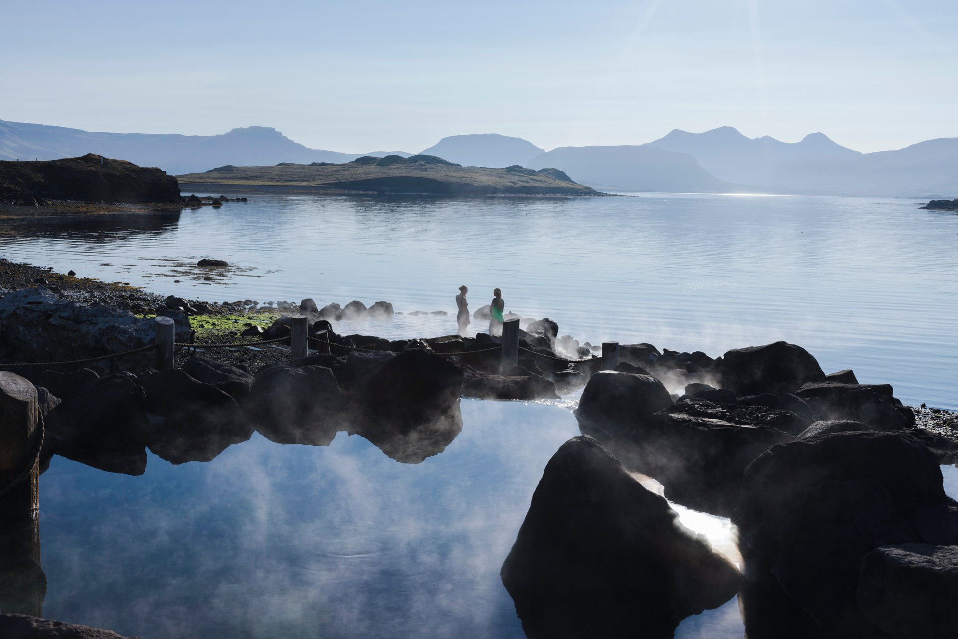 Geothermal pool overlooking ocean at Hvammsvík Hot Springs