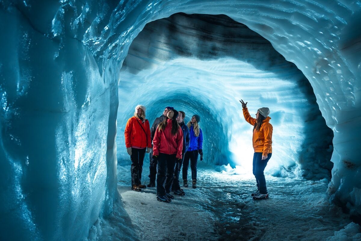 Into the Glacier ice tunnel tour entrance with professional lighting