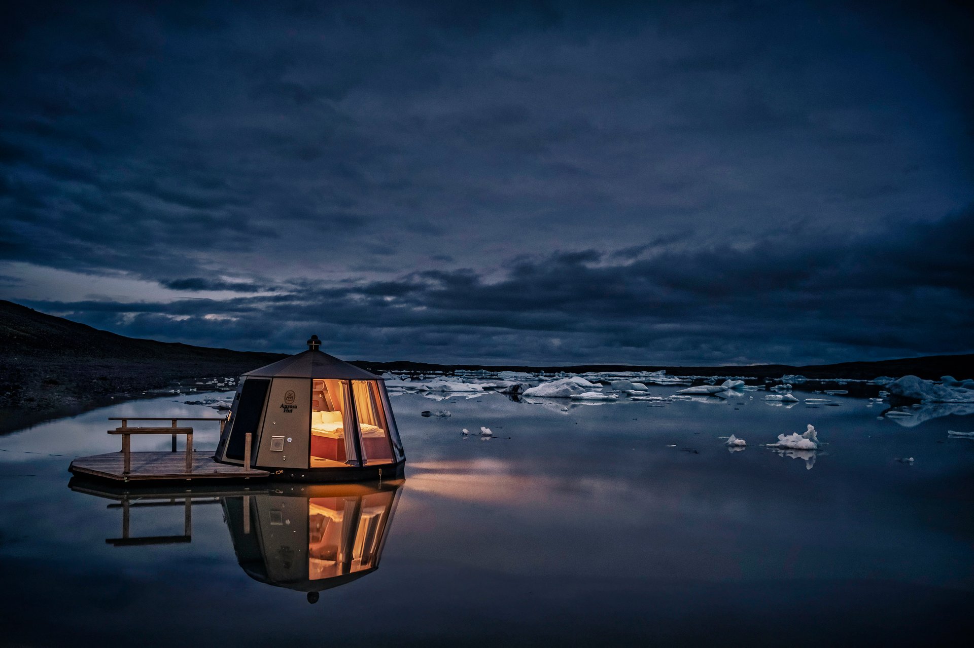 Hut glass igloo interior with panoramic Fjallsárlón Glacier views