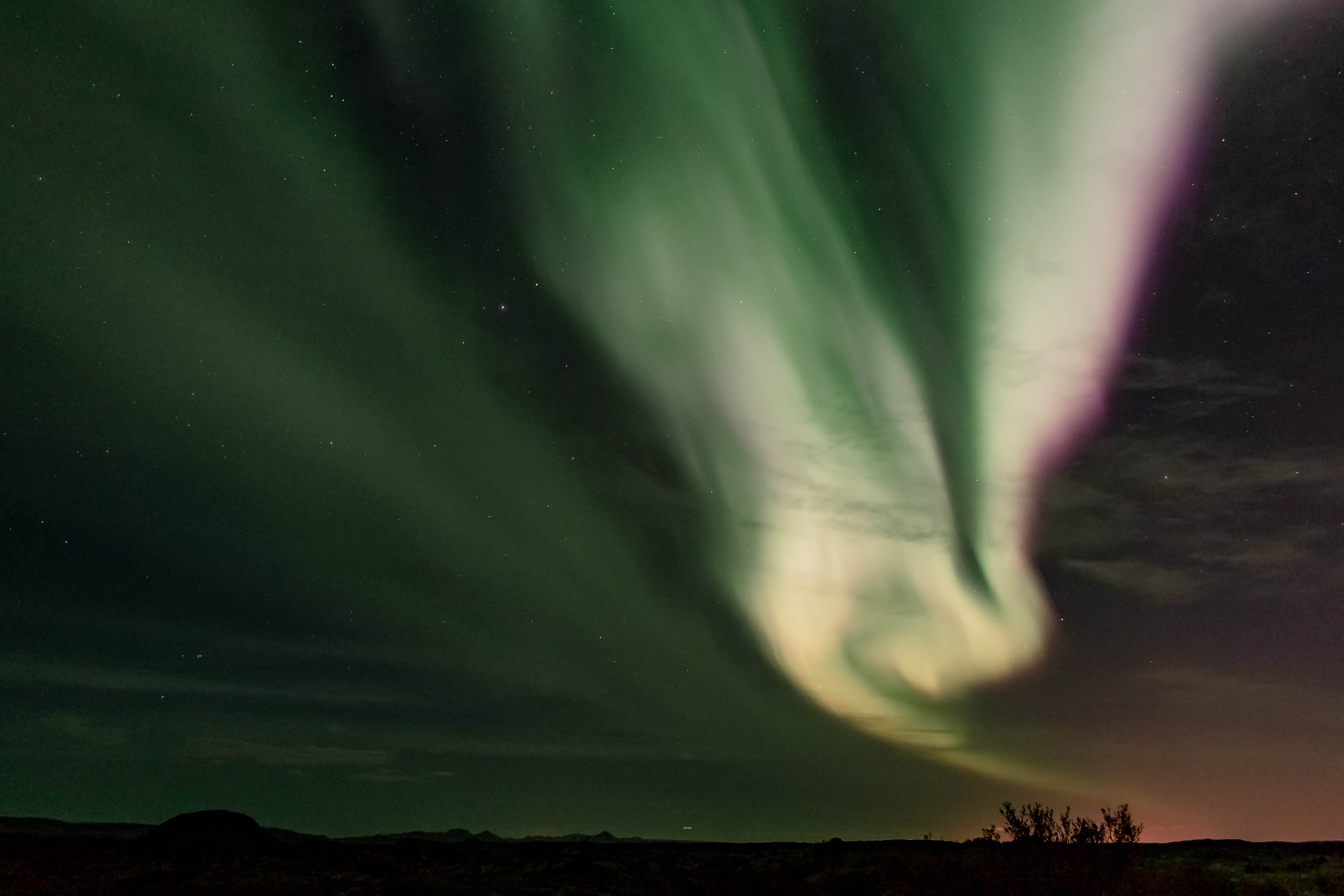 Spectacular aurora borealis display during small group Northern Lights tour Iceland