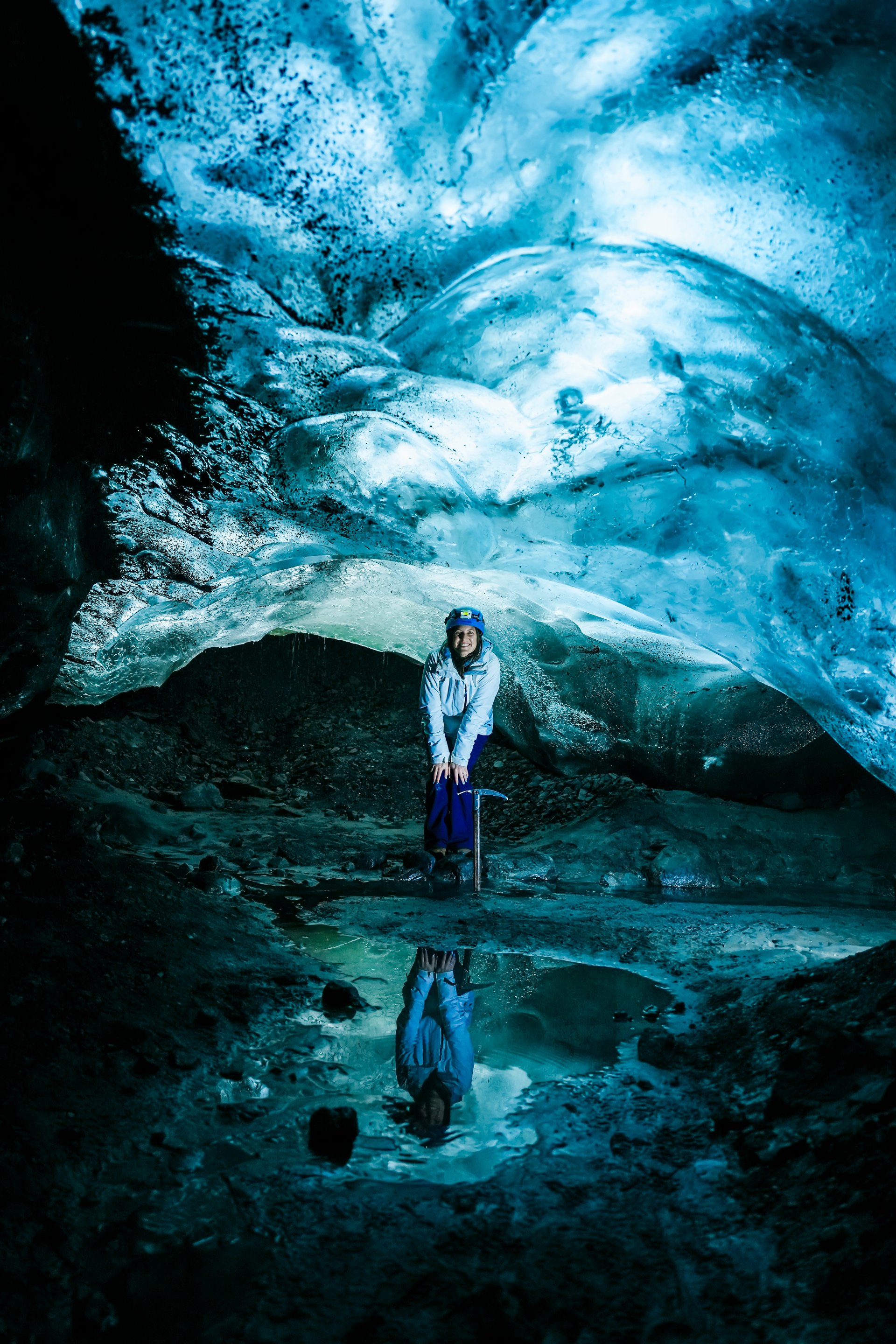 Serene crystal blue ice cave interior before crowds arrive early morning