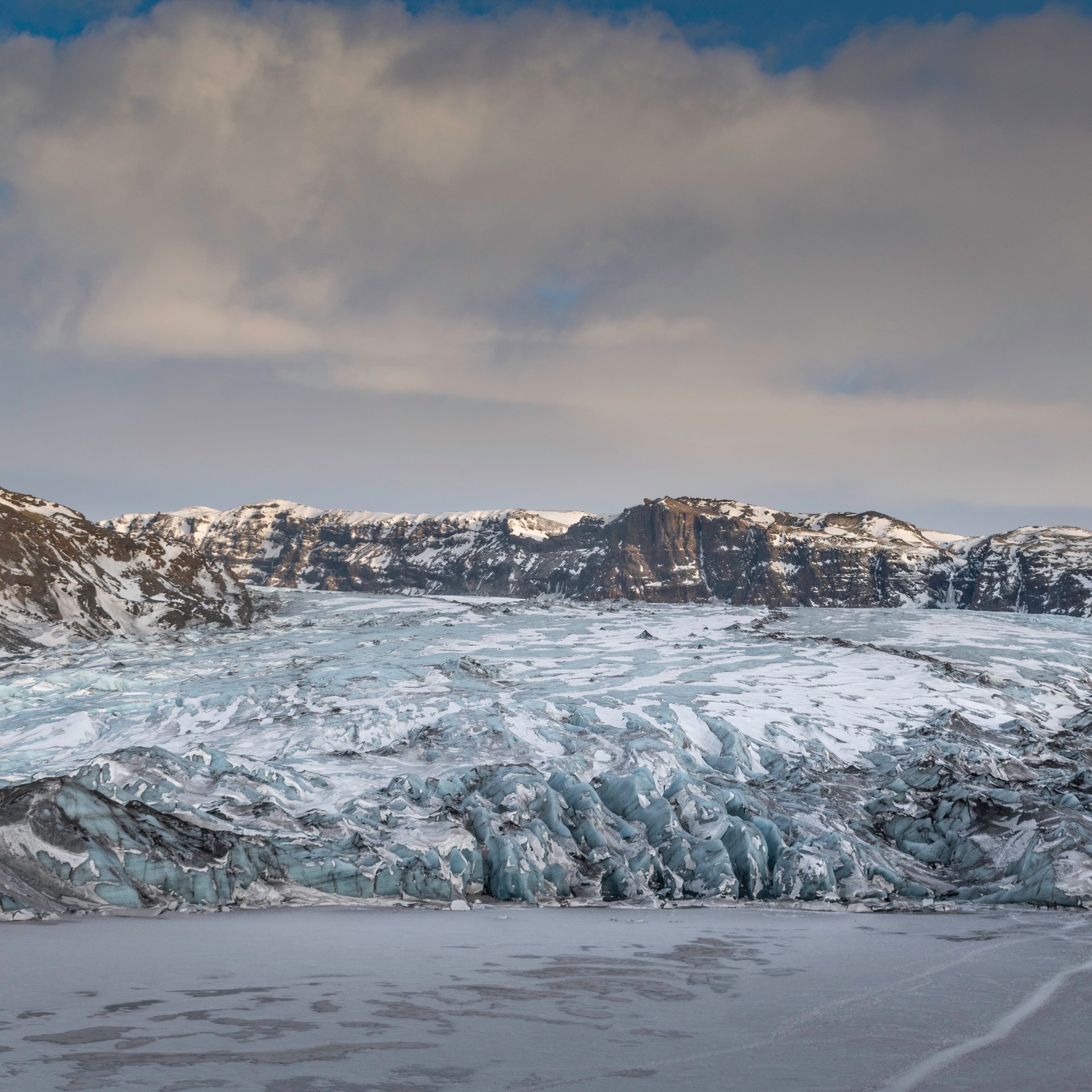 Glacier hikers exploring ice caves and crevasses