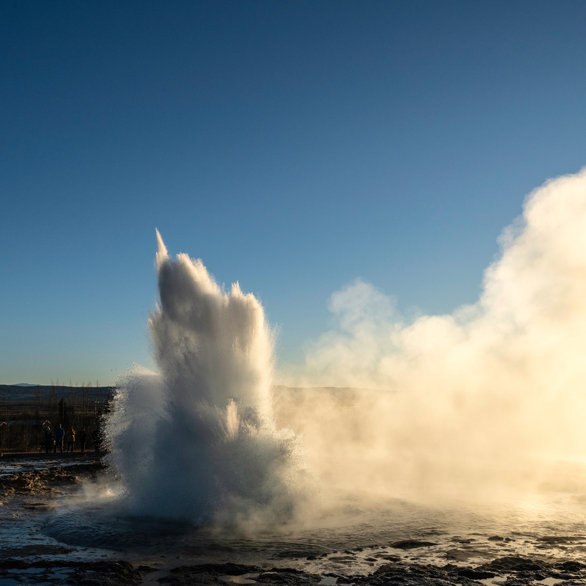 Spectacular Gullfoss waterfall with golden mist and canyon views