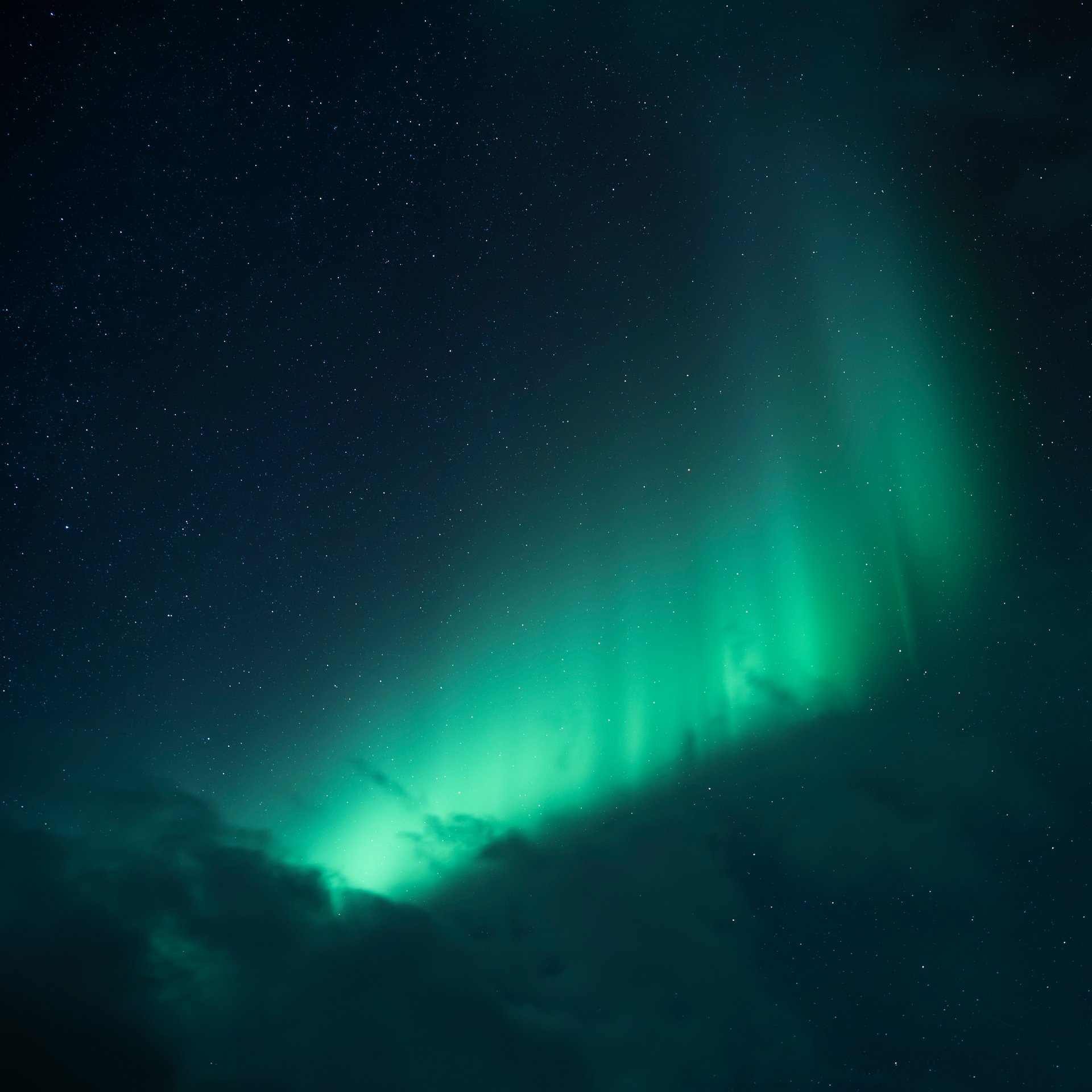 Northern Lights dancing above Iceland's volcanic landscape
