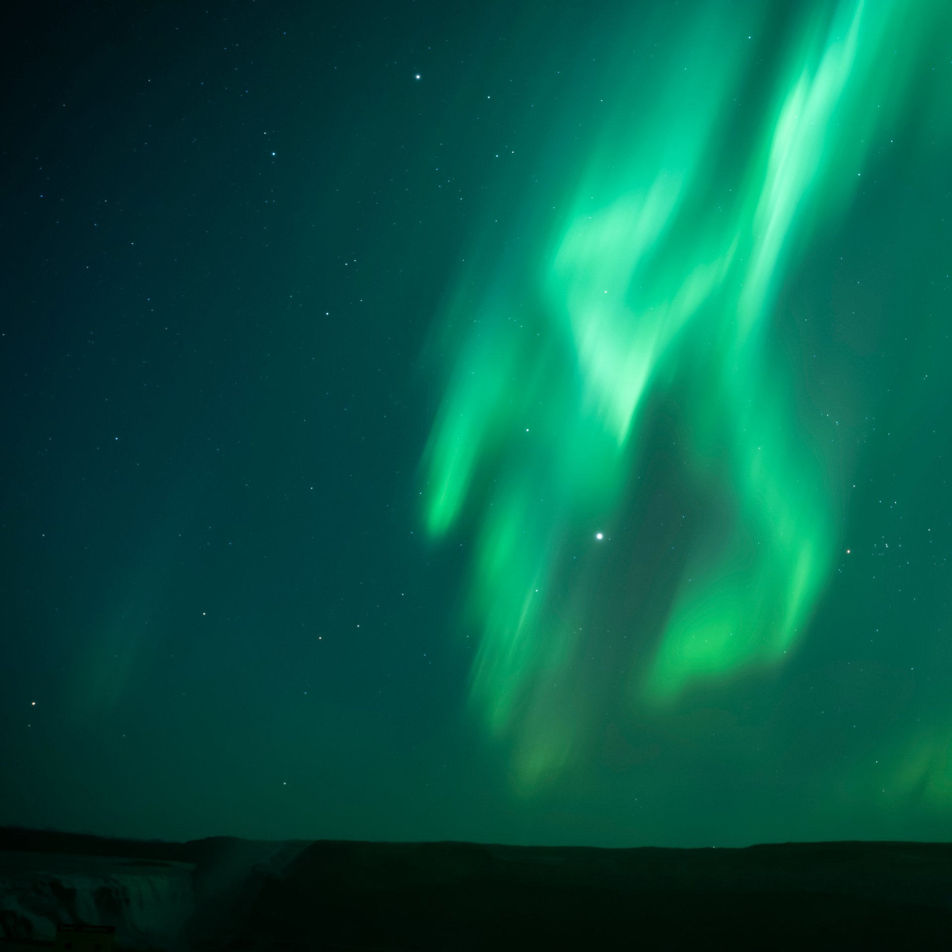 Northern Lights illuminating the dark Icelandic night