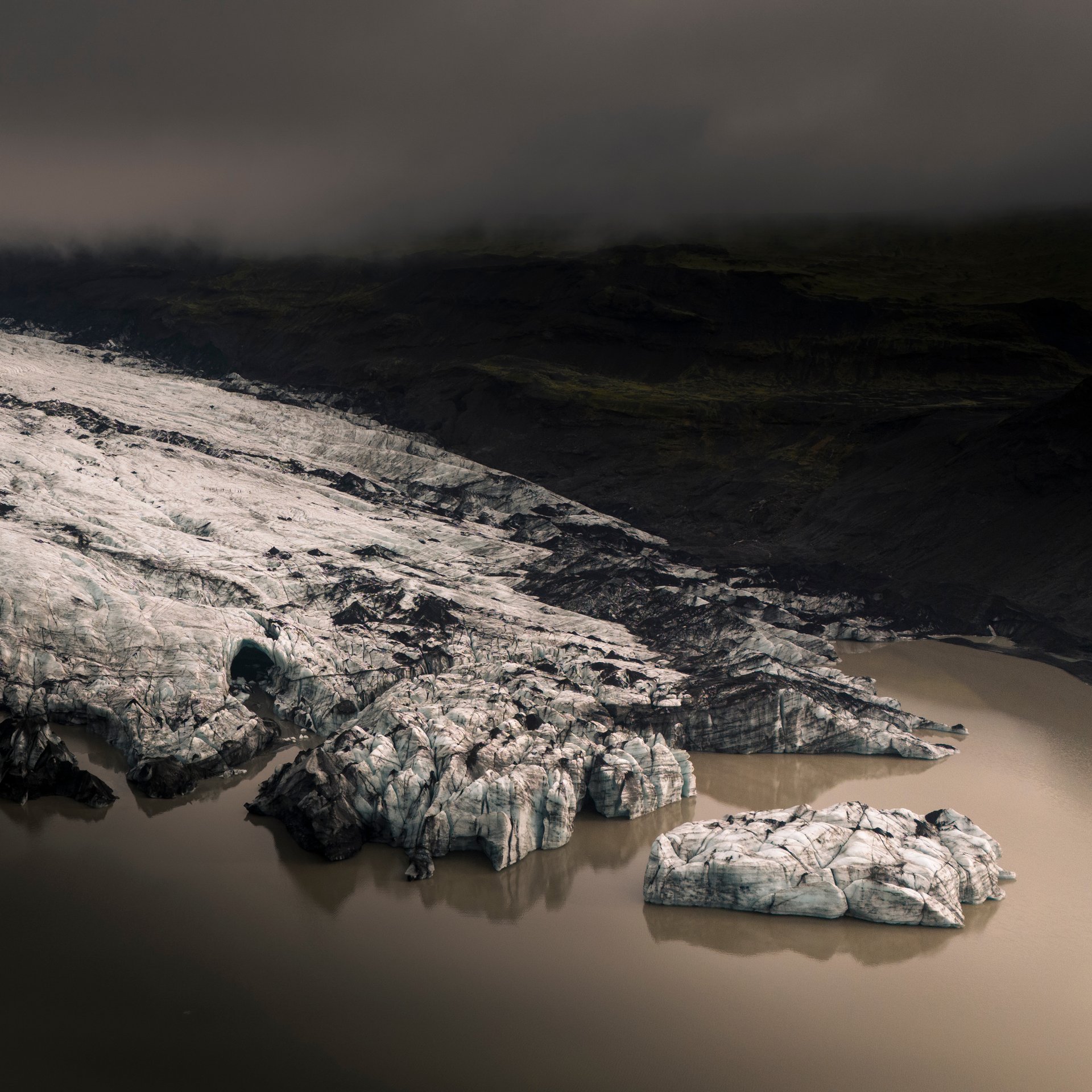 South coast waterfall with rainbow and misty atmosphere