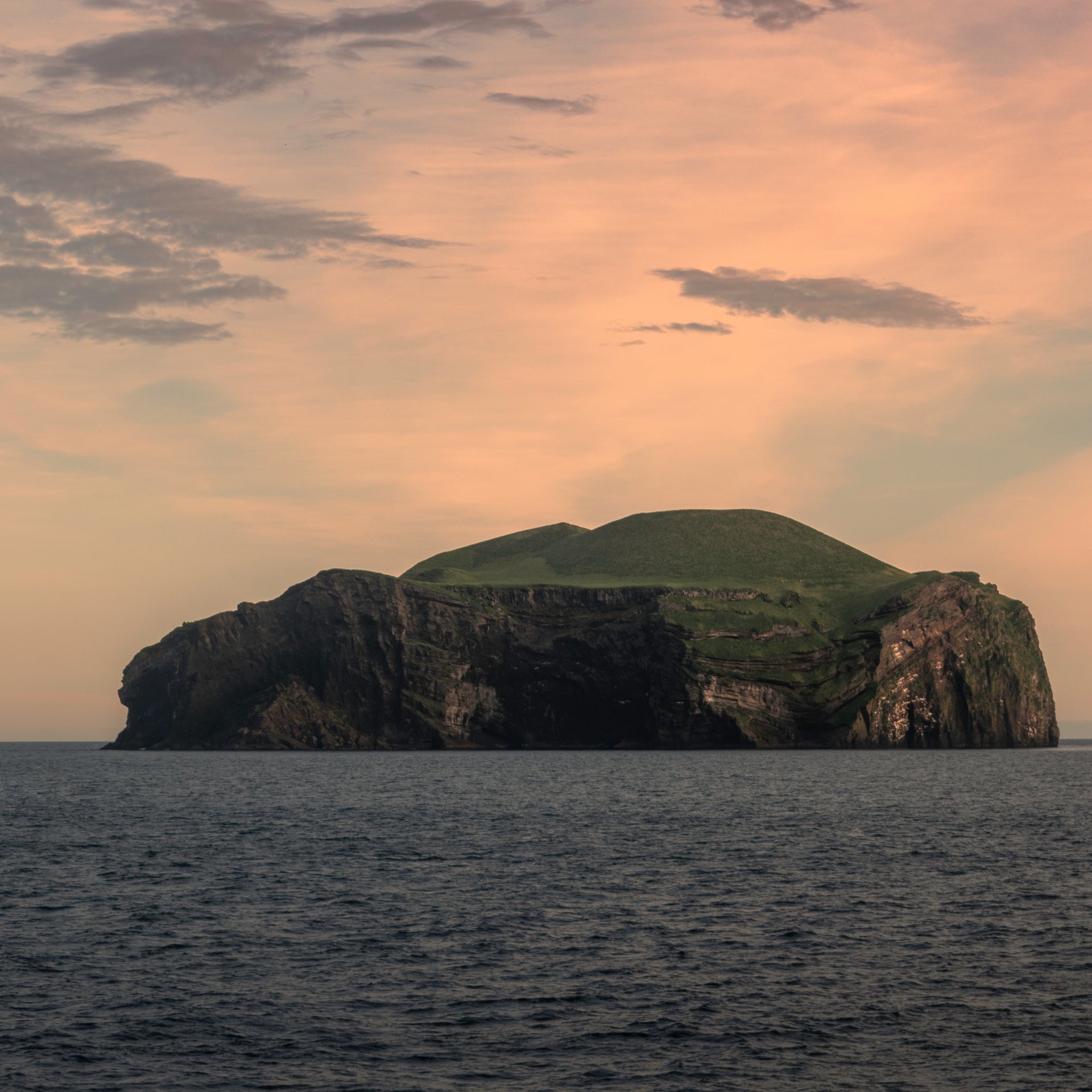 Stórhöfði lighthouse and dramatic coastal cliffs