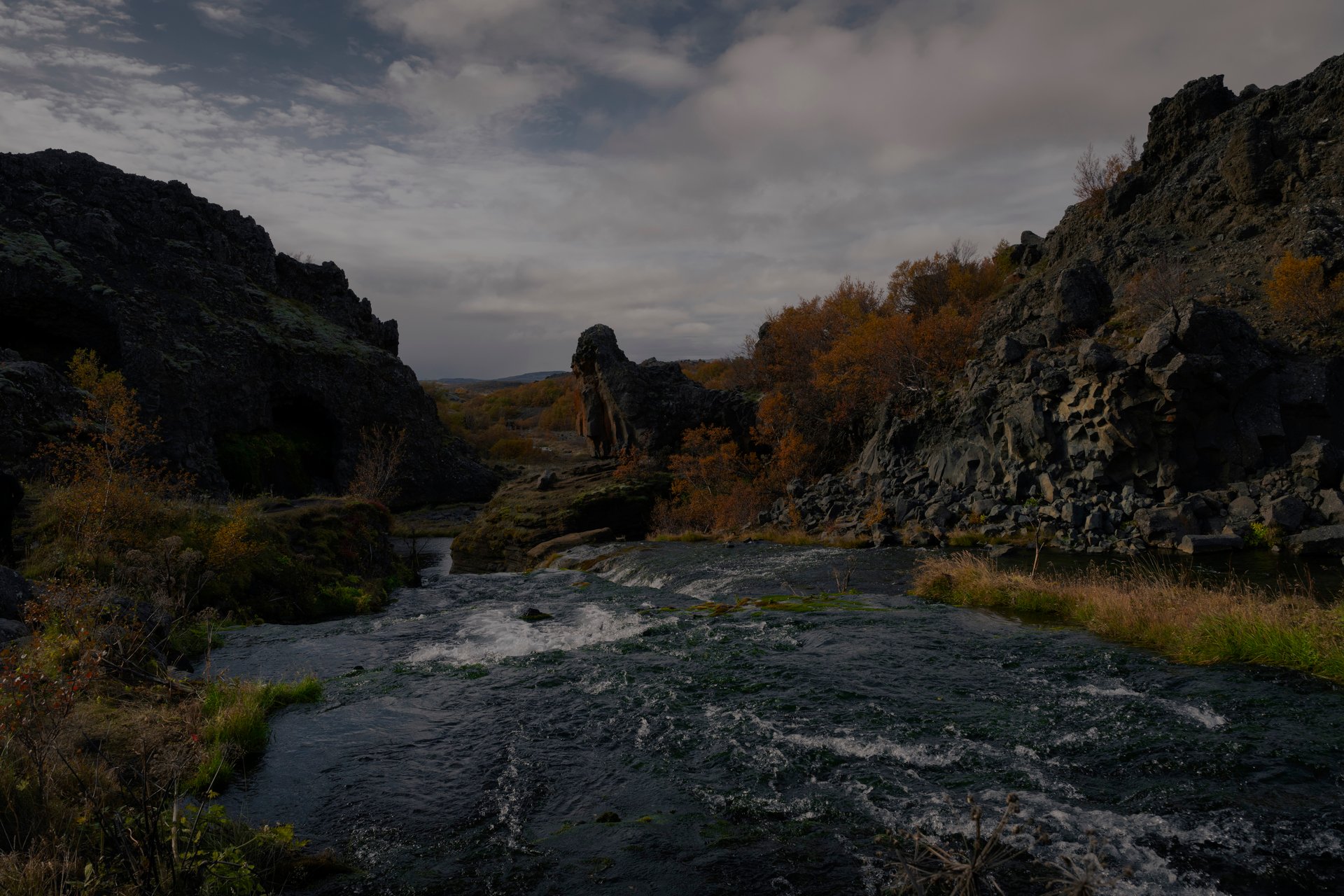 Ancient Stöng Viking settlement ruins with traditional longhouse foundations and highland backdrop