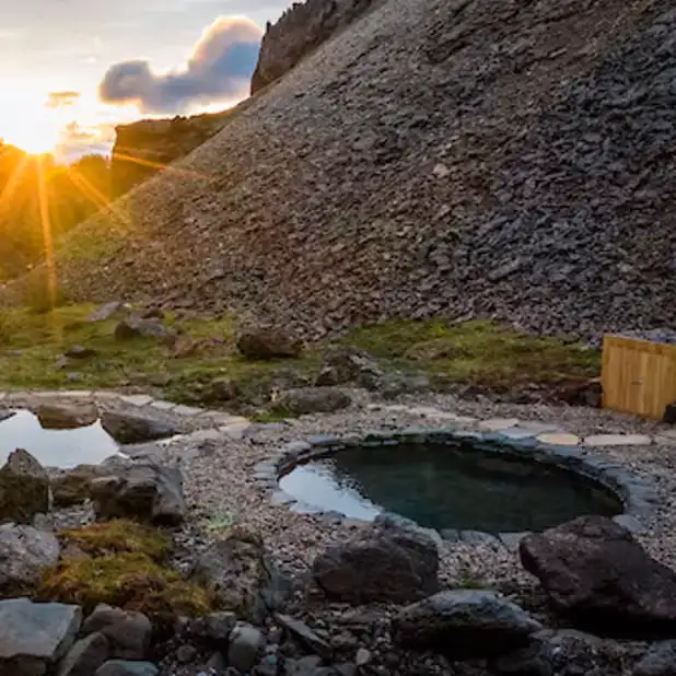 Húsafell canyon geothermal baths carved into canyon walls with highland scenery